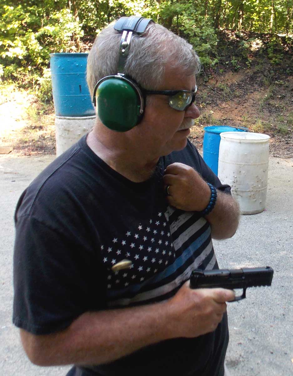Bob Campbell shooting a Smith and Wesson Shield pistol npr
