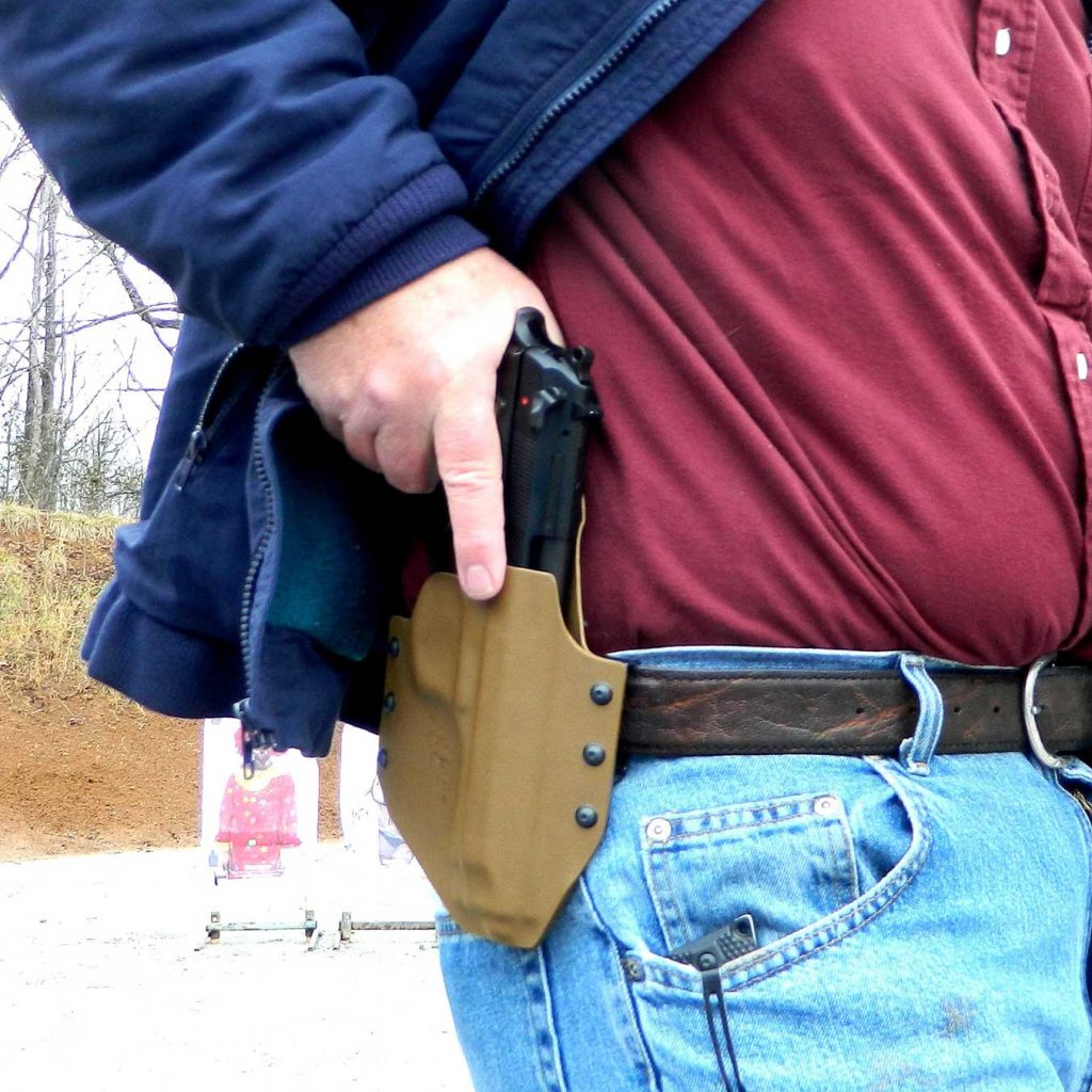 Beretta 92 being drawn from a Kydex holster