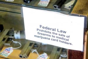Prohibition of gun sales to marijuana users sign 