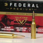 Federal 224 Valkyrie cartridges in front of an ammunition box