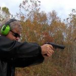 Bob Campbell shooting the Beretta M9 pistol at a low target