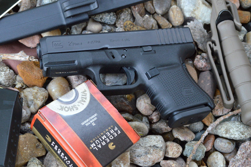 Glock G29 10mm pistol on a bed of river rock