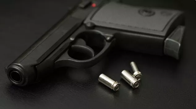 Pistol with three empty casings