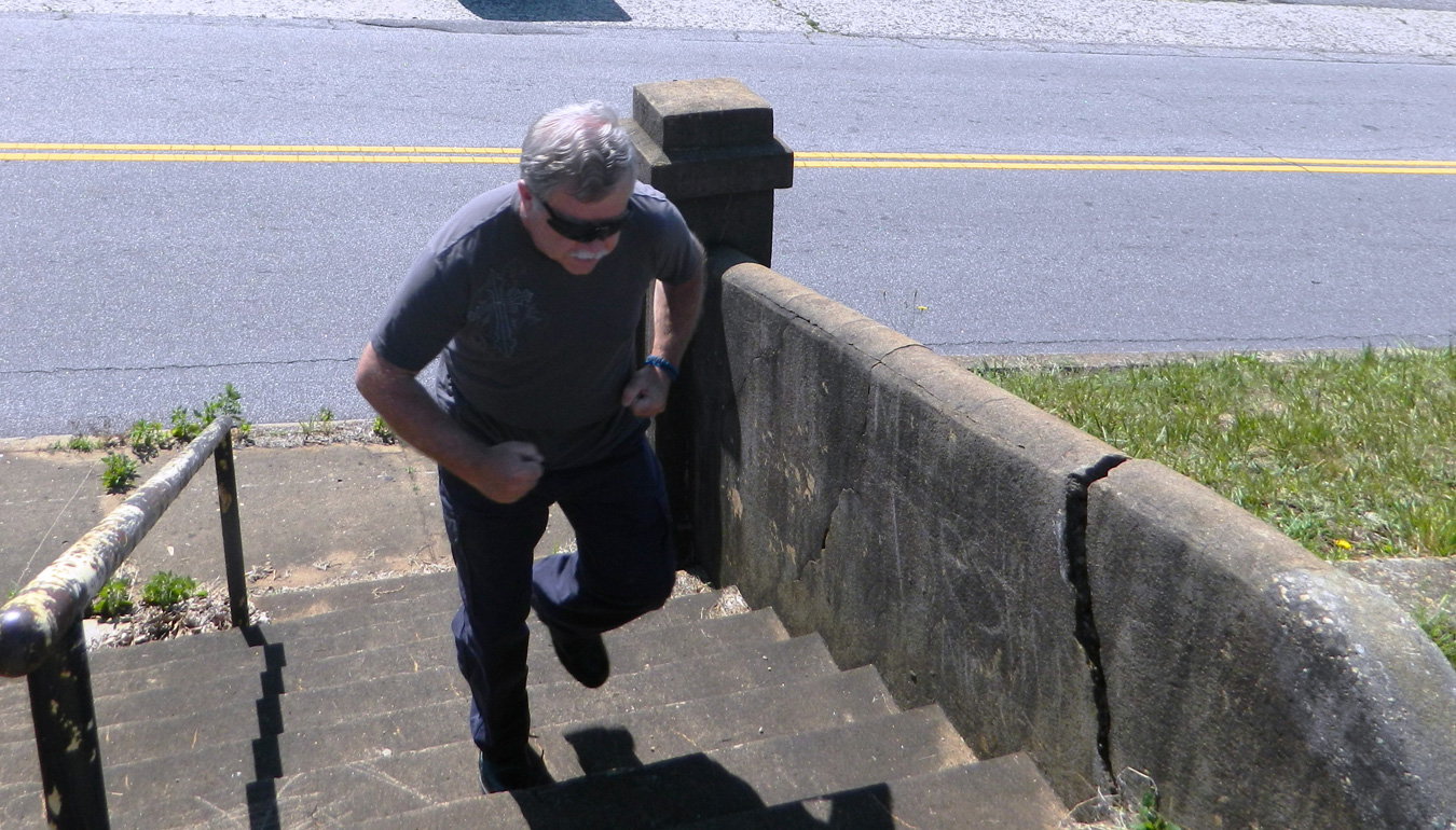 Man running up a flight of stairs