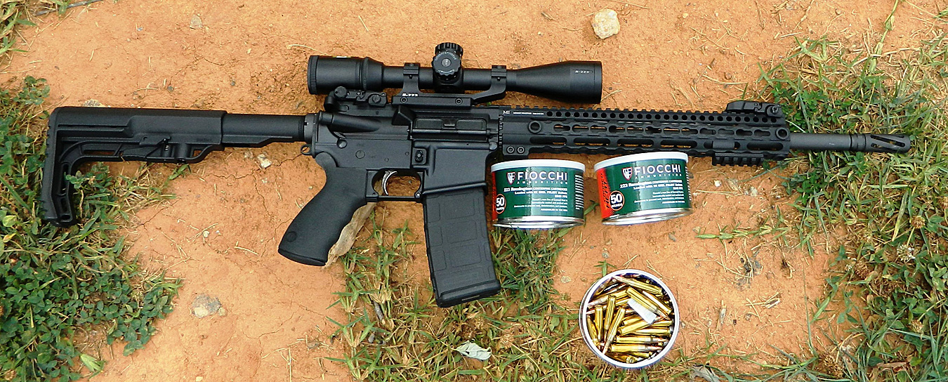 AR_15 with two cans of Fiocchi ammunition