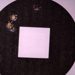 Four shot bullet group in a black and white paper group