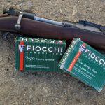Fiocchi .30-06 ammunition boxes and a Springfield 1903 rifle