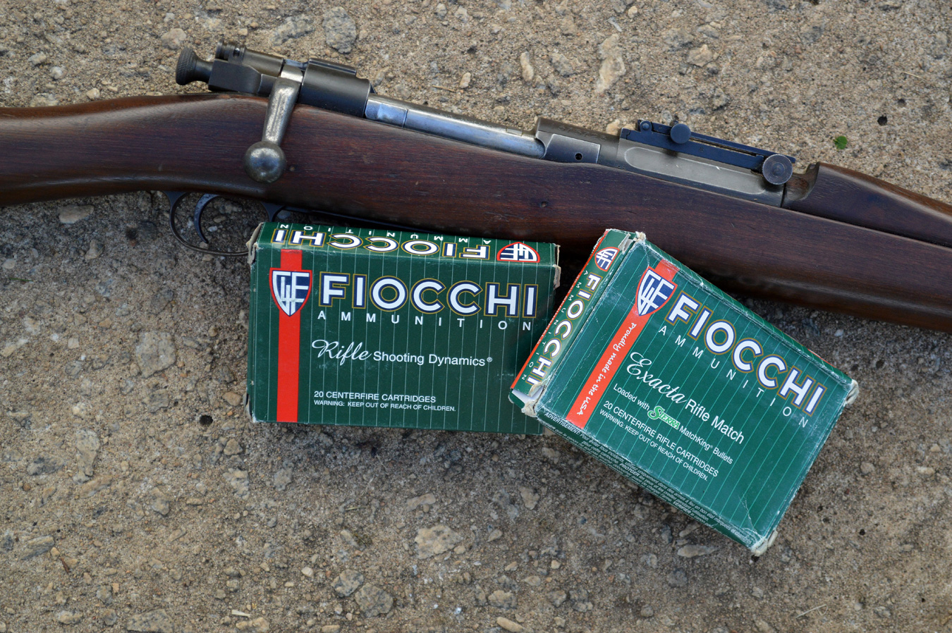 Fiocchi .30-06 ammunition boxes and a Springfield 1903 rifle