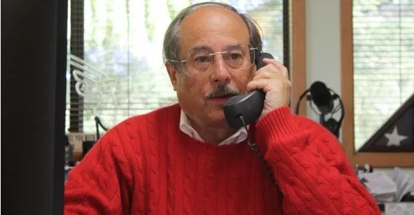 Alan Gottlieb talking on the phone at his desk