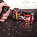 American Eagle ammunition box on a sillouhette target