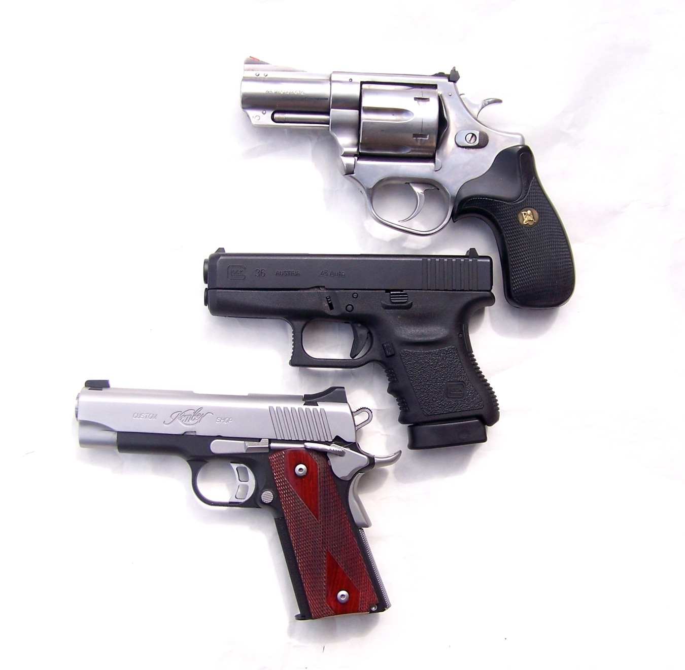 Top to bottom: revolver, Glock, 1911
