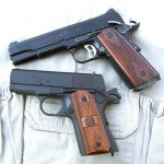 Two 1911 pistol that are cocked and locked