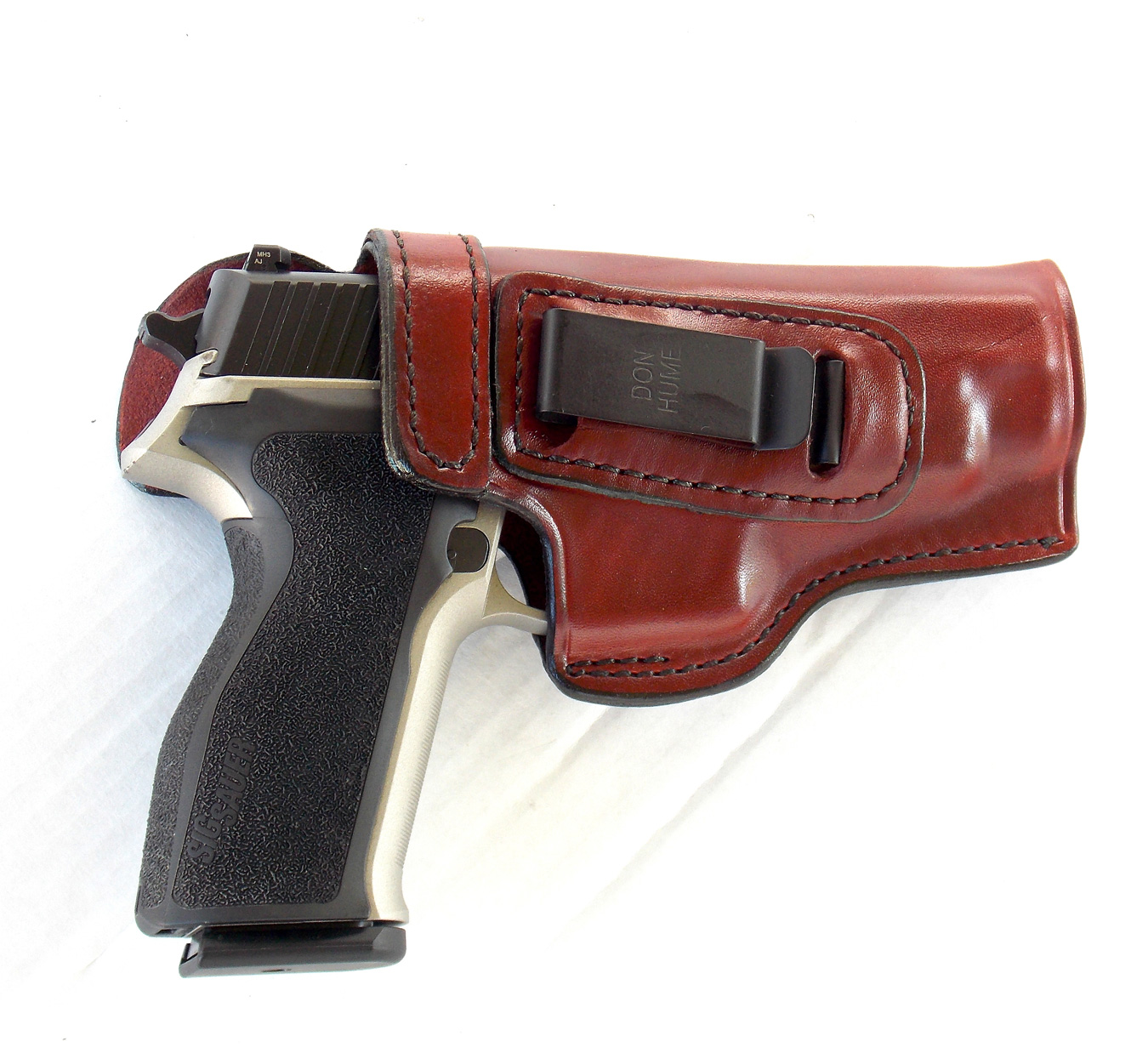 SIG P226 pistol in brown leather Don Hume holster
