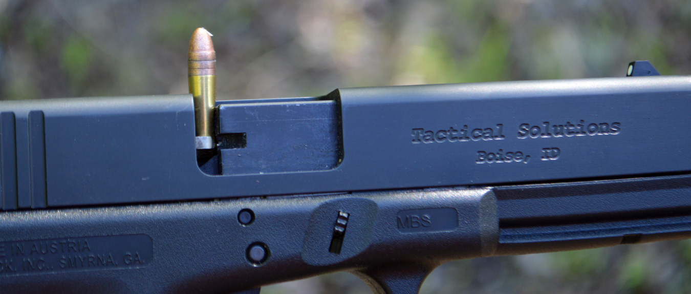 Glock pistol with a stovepipe round sticking out of the top