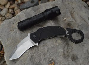 Extrema Ratio Nightmare Karambit open with blade left and flashlight