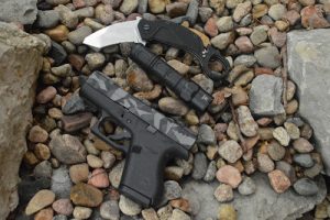 Extrema Ratio Nightmare Karambit with Glock and flashlight