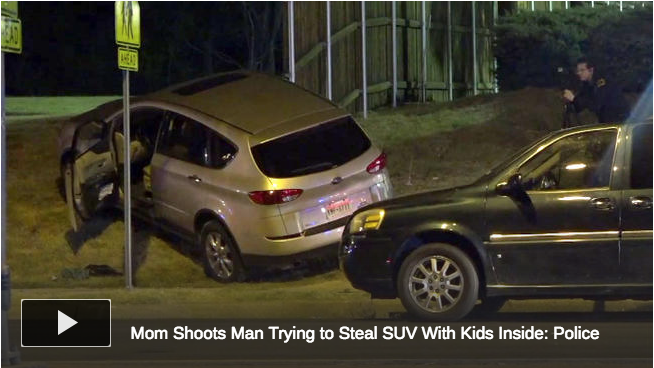 Wrecked SUV on embankment Armed Good Guys