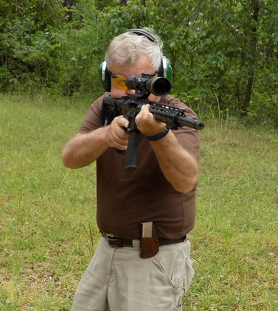 Bob Campbell shooting an AR-15 from an offhand position for rifle marksmanship
