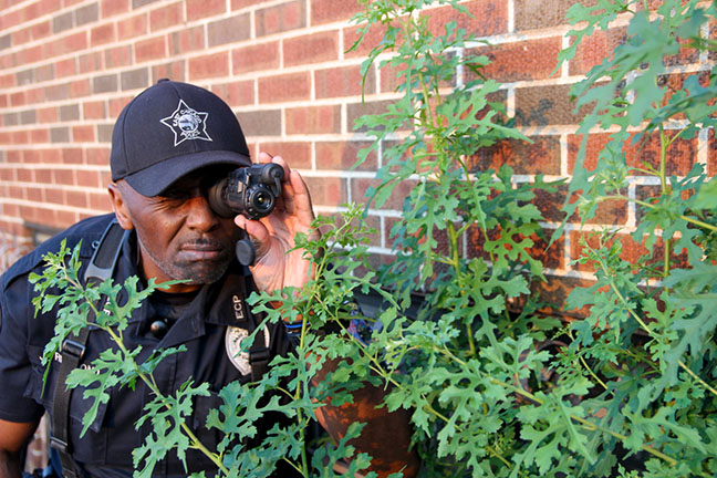 Patrolman John Richmond tests the daytime classification capabilities of the FLIR Breach PTQ136 multifunctional thermal imaging monocular