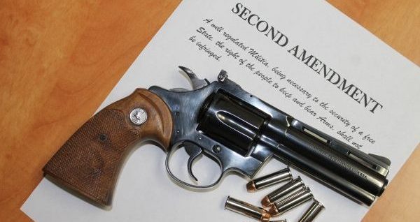 Revolver atop a copy of the Second Amendment