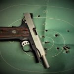 Ruger 1911 Commander on a green silhouette target