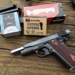 Colt 1911 pistol with three boxes of ammunition