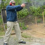 Bob Campbell shooting the Commander 1911 with a two hand grip