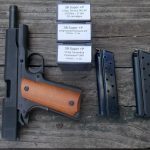 .38 Super handgun with two MecGar magazines and three ammunition boxes