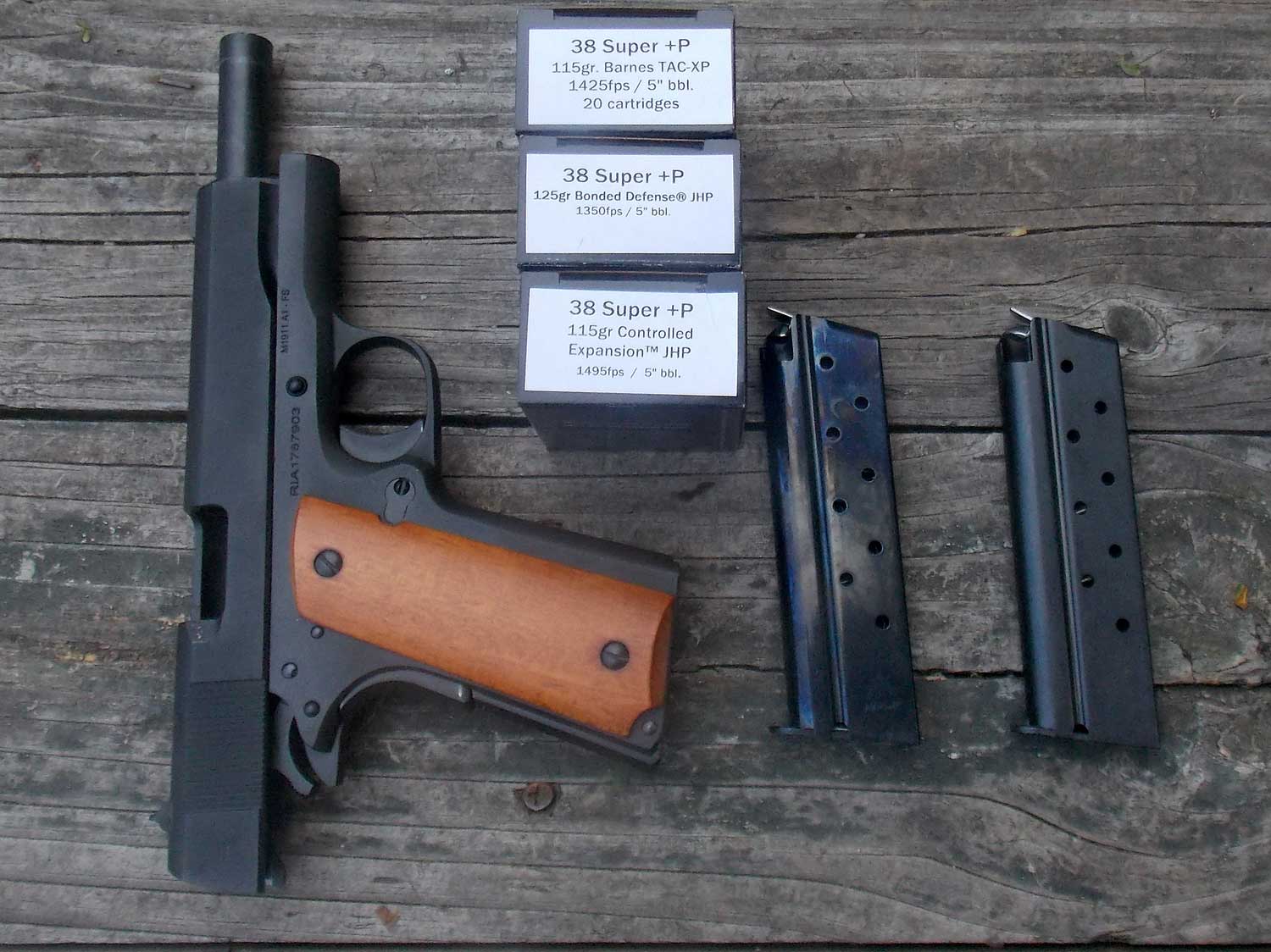 .38 Super handgun with two MecGar magazines and three ammunition boxes