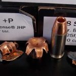 Close up of Double Tap ammunition cartridge and upset bullet
