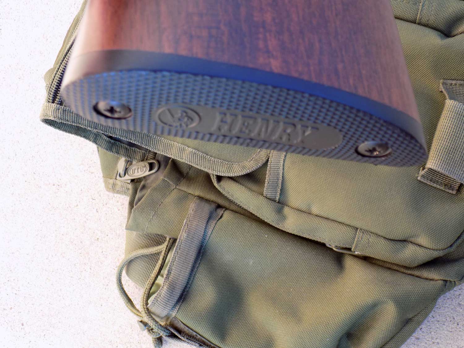 checkered plastic buttplate on the Henry Octagon pump rifle