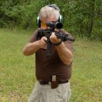Bob Campbell with a Wilson Combat .224 Valkyrie rifle at the shouldered position