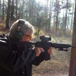 Bob Campbell shooting an AR-15 rifle topped with a SIG Romeo red dot sight