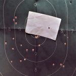 silhouette target with holes from a shotgun