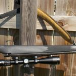 Mossberg ATR rifle hanging upside down by the sling