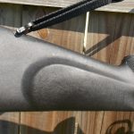 Molded cheek rest on riflescope