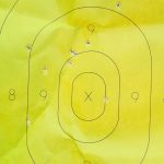 25-yard group on a yellow paper target