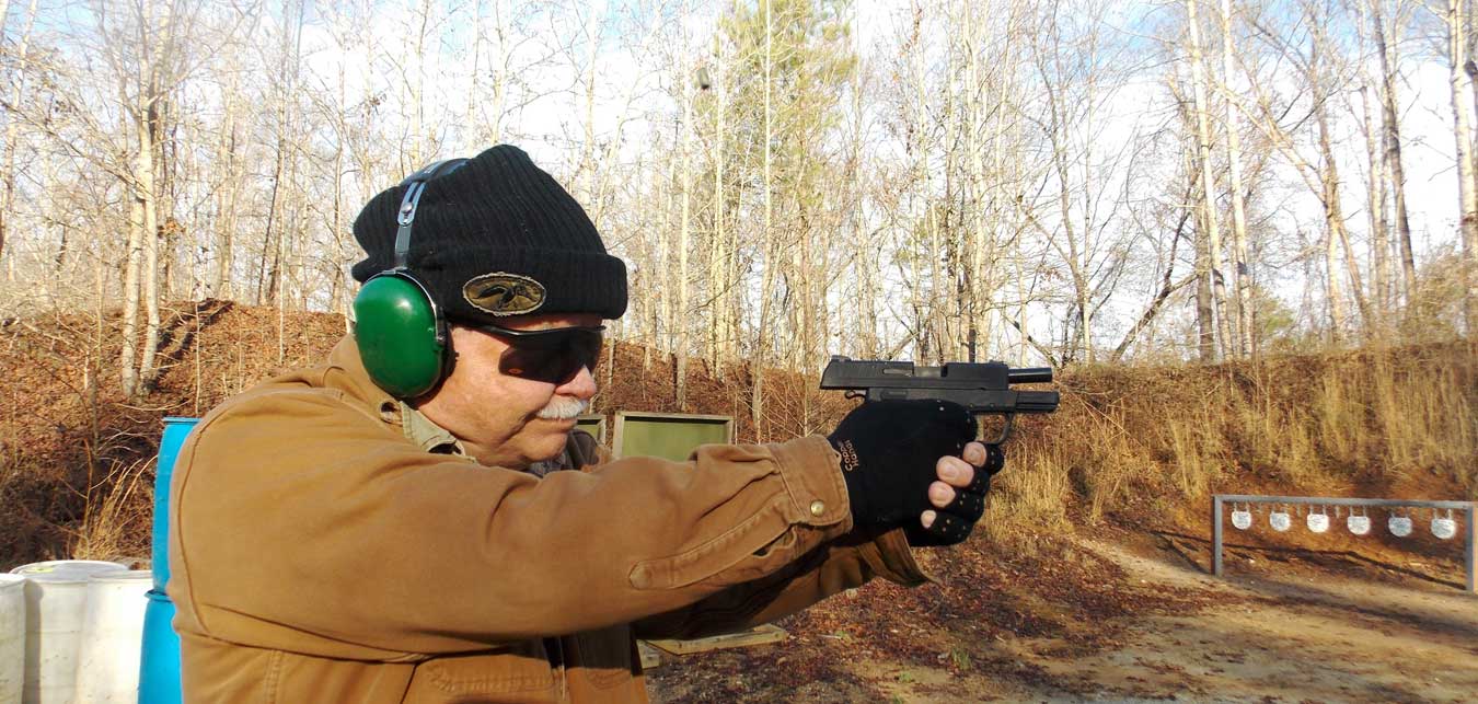 Bob Campbell shppting the Springfield XDE pistolwith slide locked back
