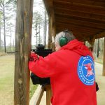 Bob Campbell shooting a rifle