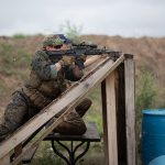 Shooter laying on an angled barricade