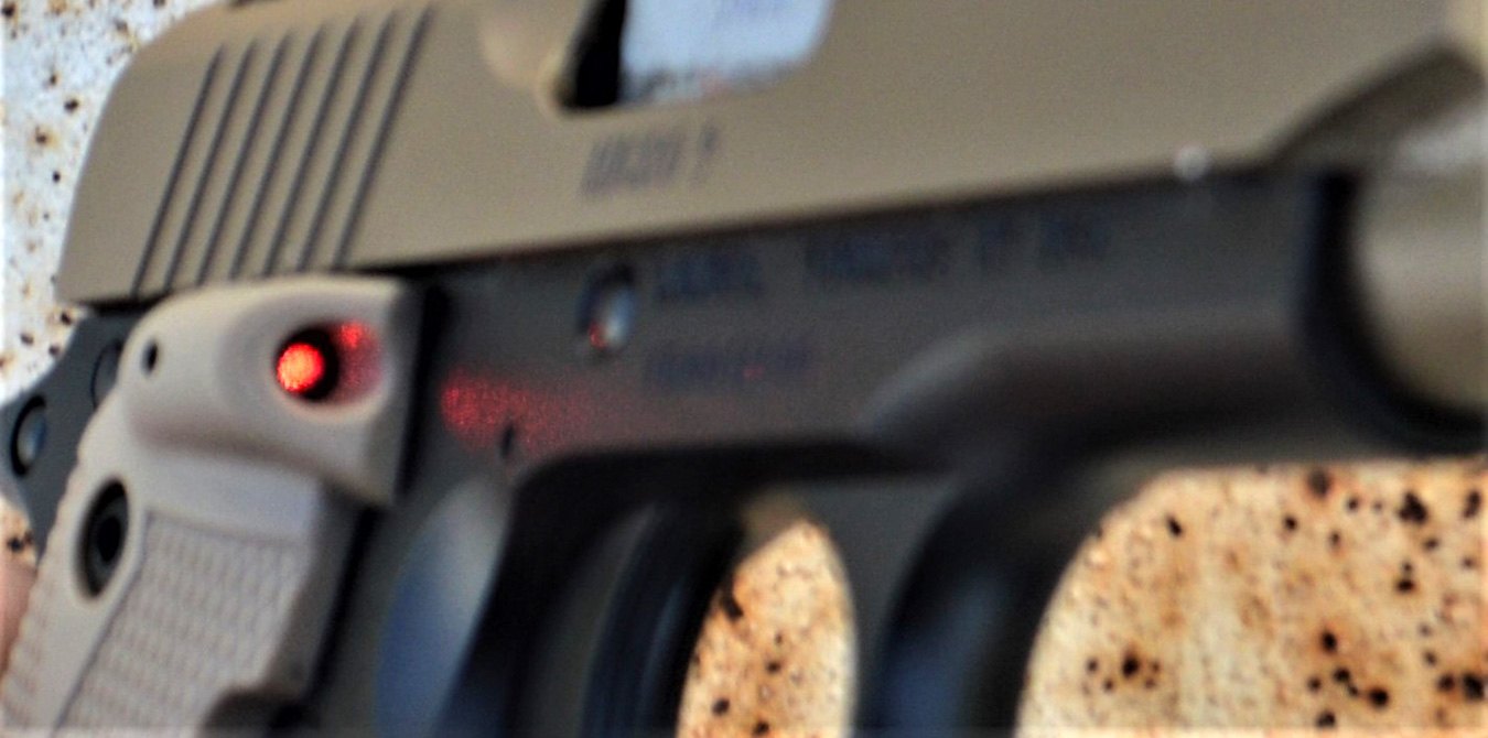 Beam of a laser on a pistol