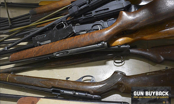 Old .22 rifles and shotgun from a gun buyback