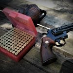 Colt Python revolver with box of handloaded ammunition