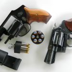 Two snubnose .38 revolvers with speedloaders