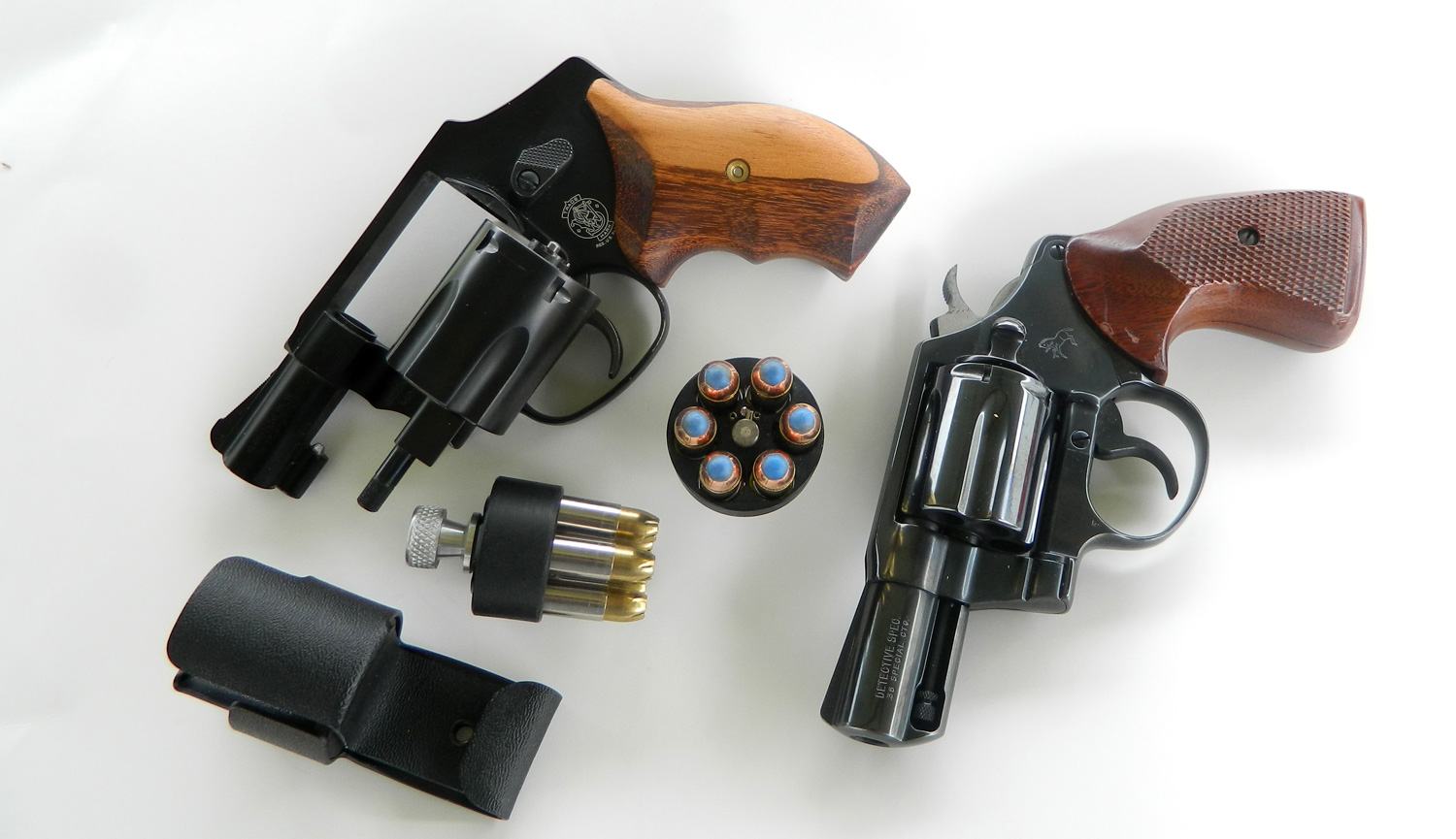 Two snubnose .38 revolvers with speedloaders