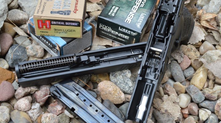 Disassembled Walther Creed pistol with two boxes of ammunition