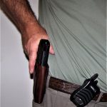 Presenting a handgun from a leather holster