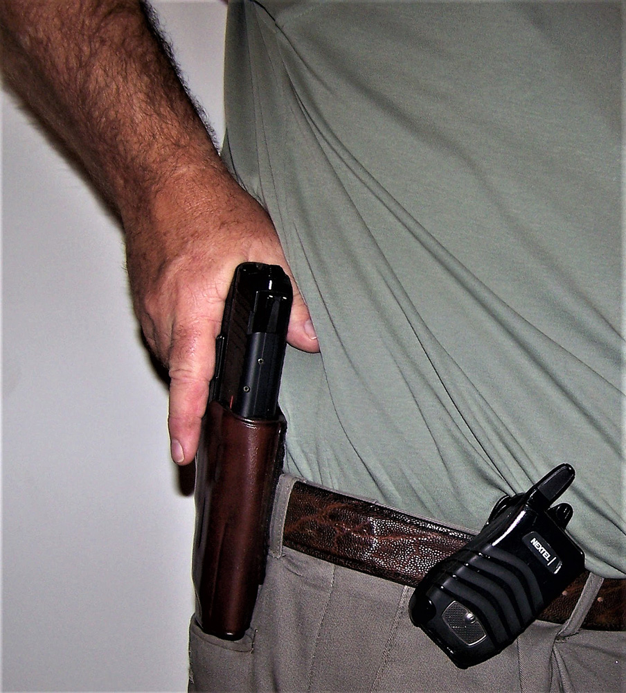 Presenting a handgun from a leather holster