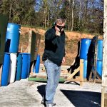 Holding a pistol with a one-hand combat stance