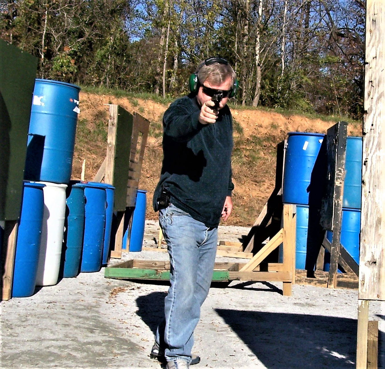 Holding a pistol with a one-hand combat stance